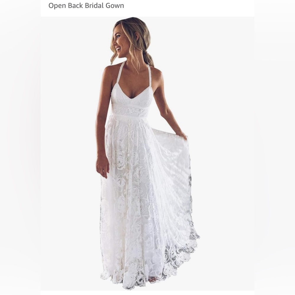Stunning lacy backless wedding dress.